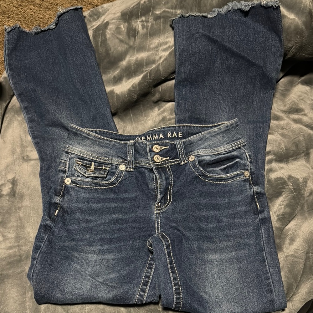 Blue Boot Cut Jeans with Distressed Details